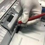 Gloved Hand Fixing Printer